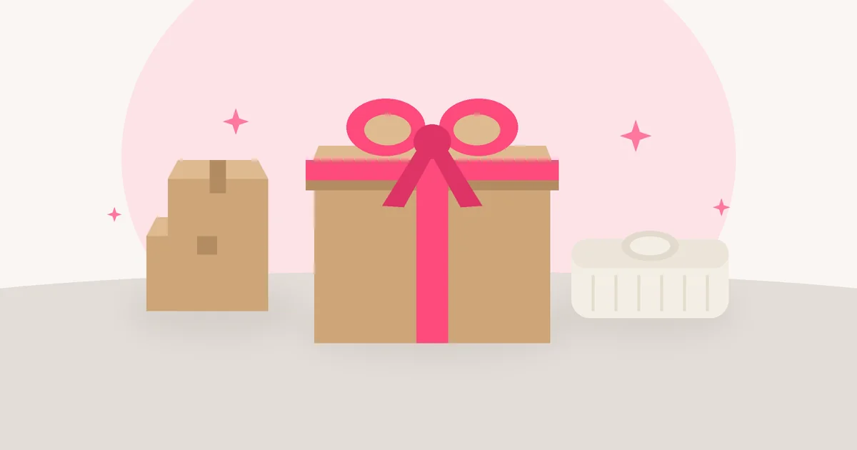 Flat illustration of a kraft gift box tied with a pink ribbon beside smaller shipping boxes and a folded sweater on a neutral tabletop.